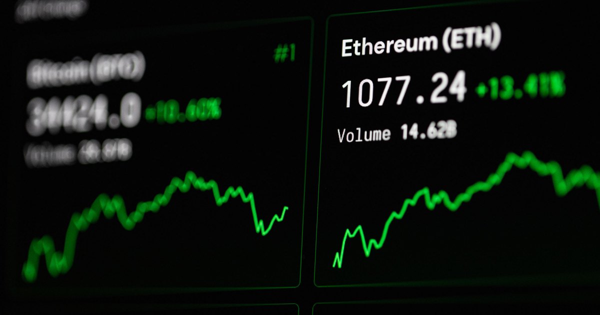 Close-up of cryptocurrency market data with Ethereum and Bitcoin prices on screen.
