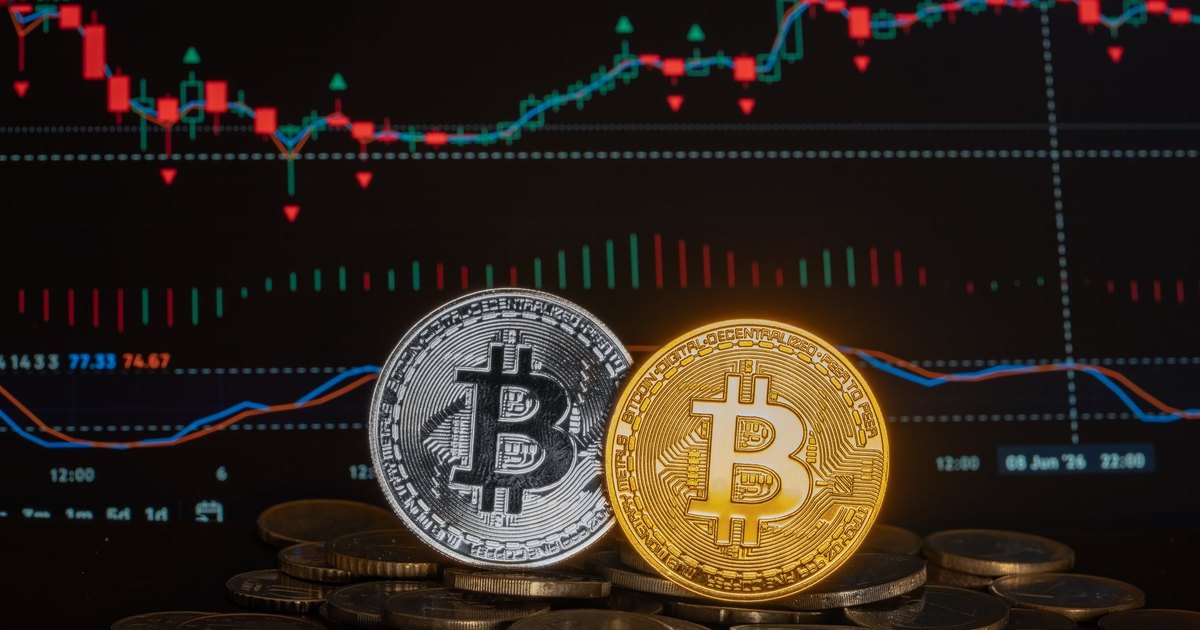 Cryptocurrency coins with a financial market graph in the background, symbolizing investment and economic trends.