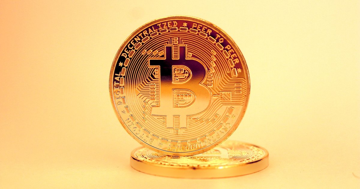 A close-up of a golden Bitcoin highlighting its digital currency design.