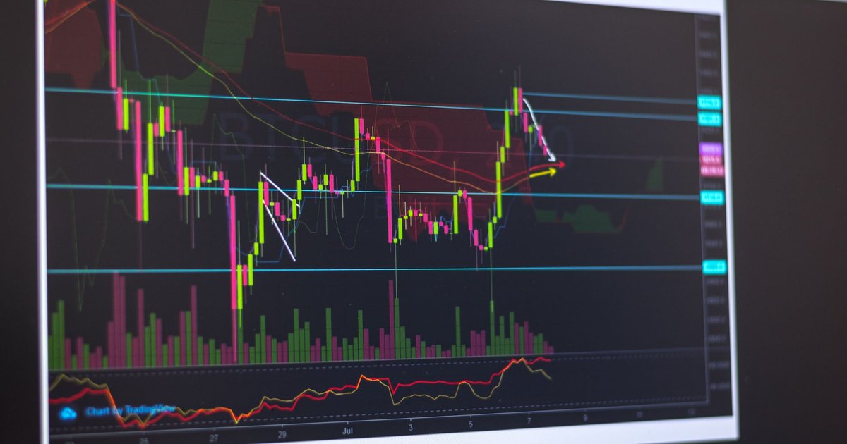 Close-up of a computer screen displaying cryptocurrency market trends and trading data.