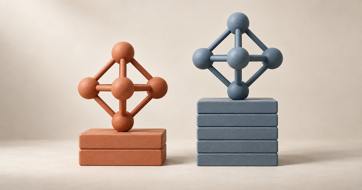 Editorial illustration: An orange sculpture of connected spheres rests on a short stack of rectangular blocks beside a matching blue-gray sculpture on a taller stack, against a beige background.
