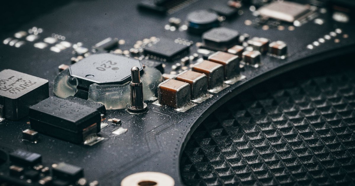 Detailed macro shot of an electronic circuit board showcasing various components.