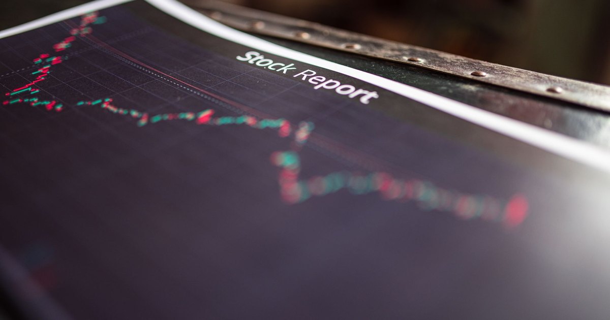 Detailed stock report showing market trends on paper charts.